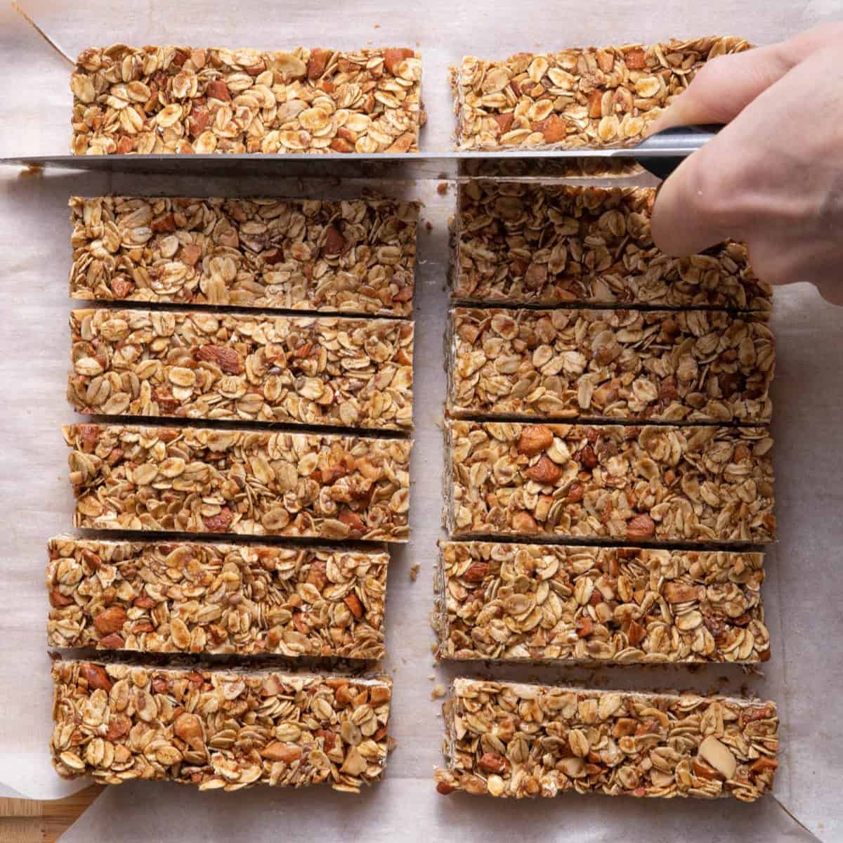 Cutting into bars on parchment paper.