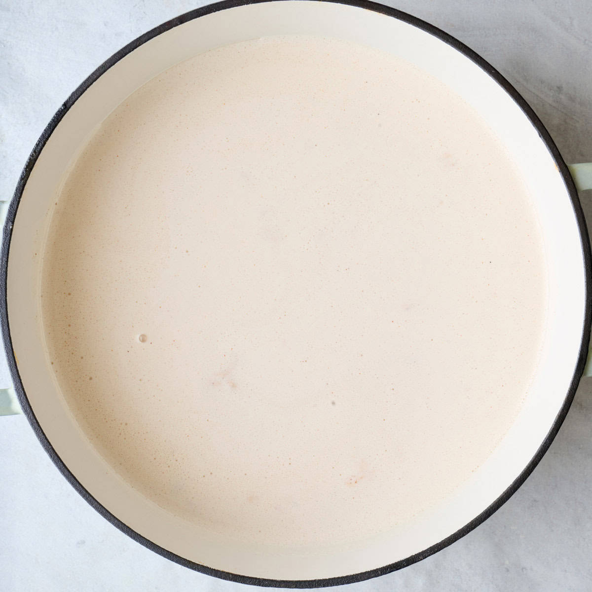 Blended cottage cheese sauce in a pot.