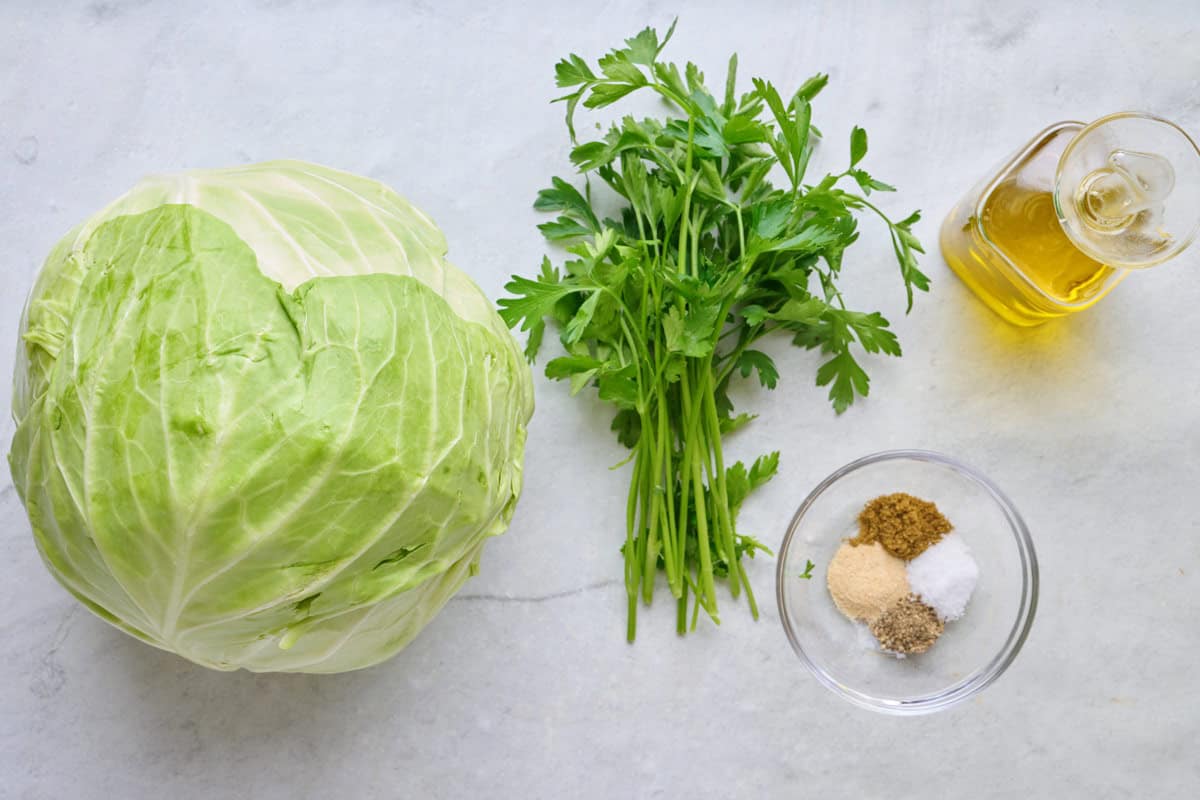 Ingredients for recipe: cabbage, parsley, seasonings, and oil.