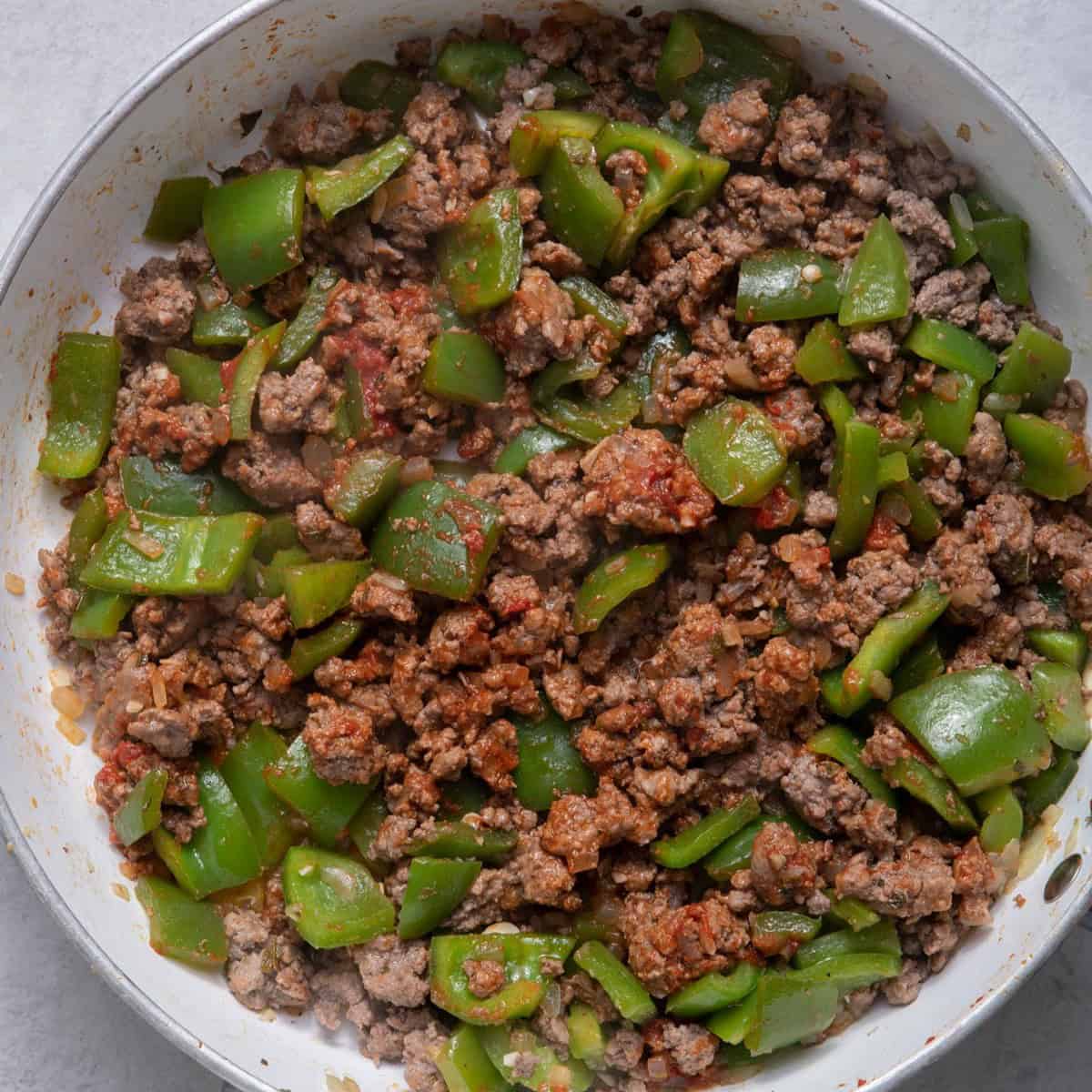 Cooked beef with tomato paste mixed well.