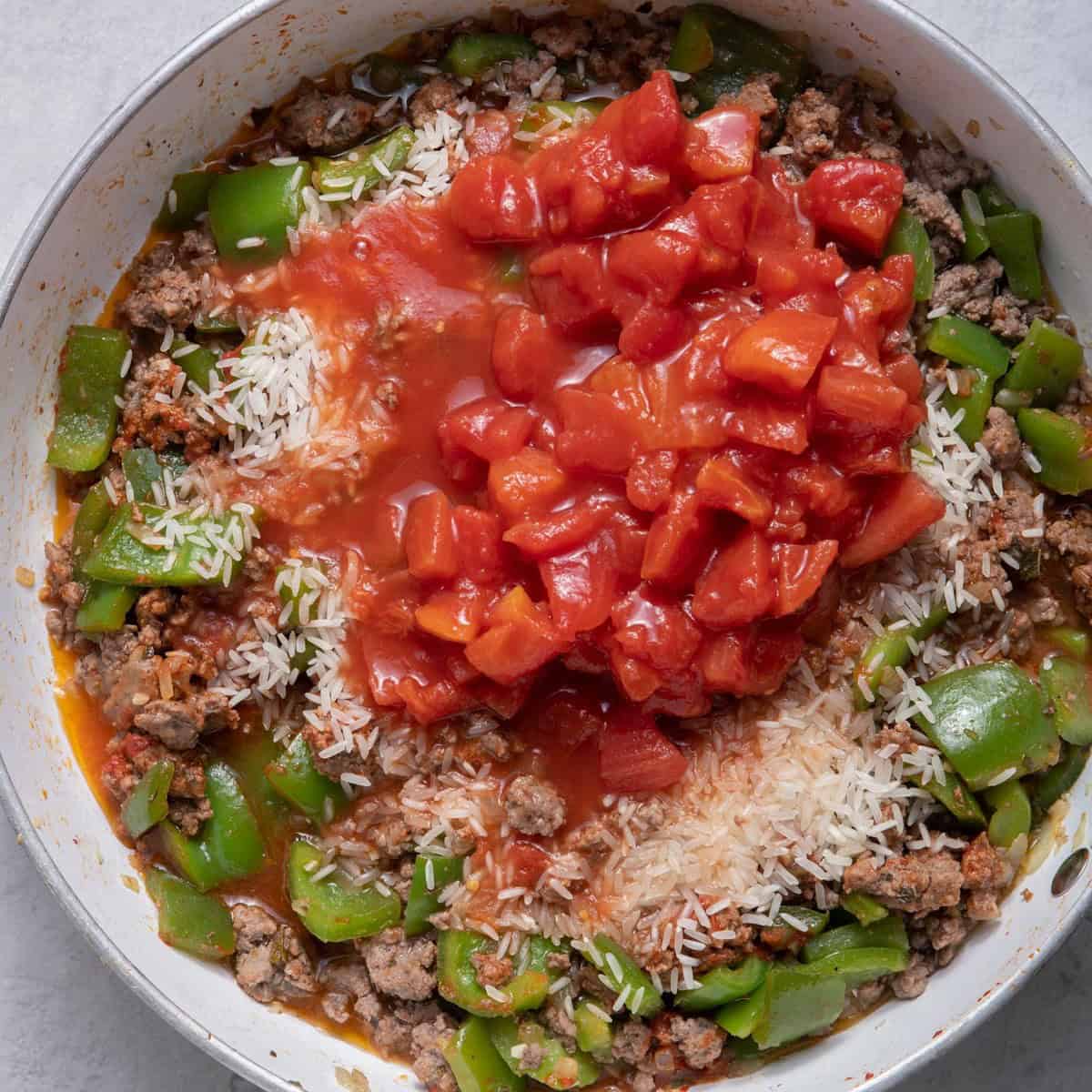 Rice, diced tomatoes and water added.