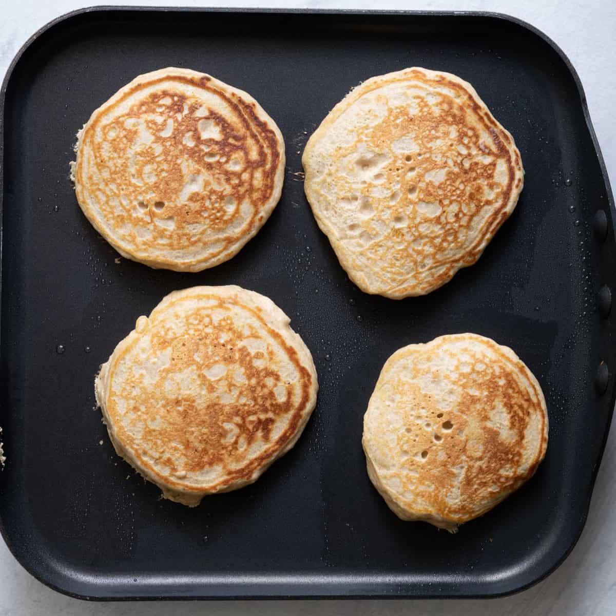 Pancakes on griddle after cooked.