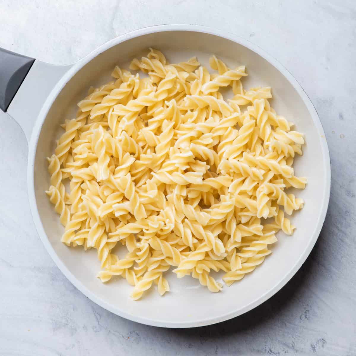 Cooked pasta in a pan.