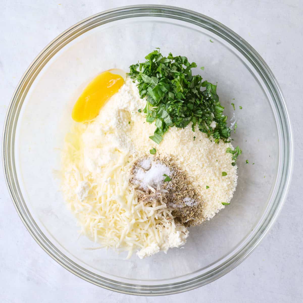 Cheese filling ingredients in a bowl before combining.