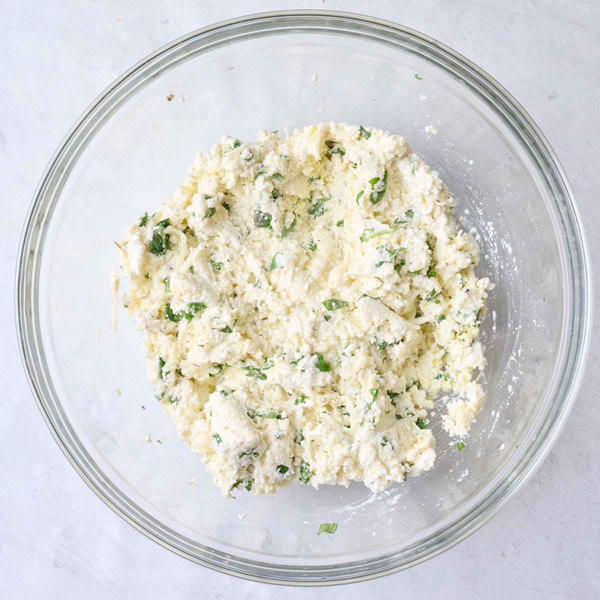 Cheese filling ingredients in a bowl after combining.