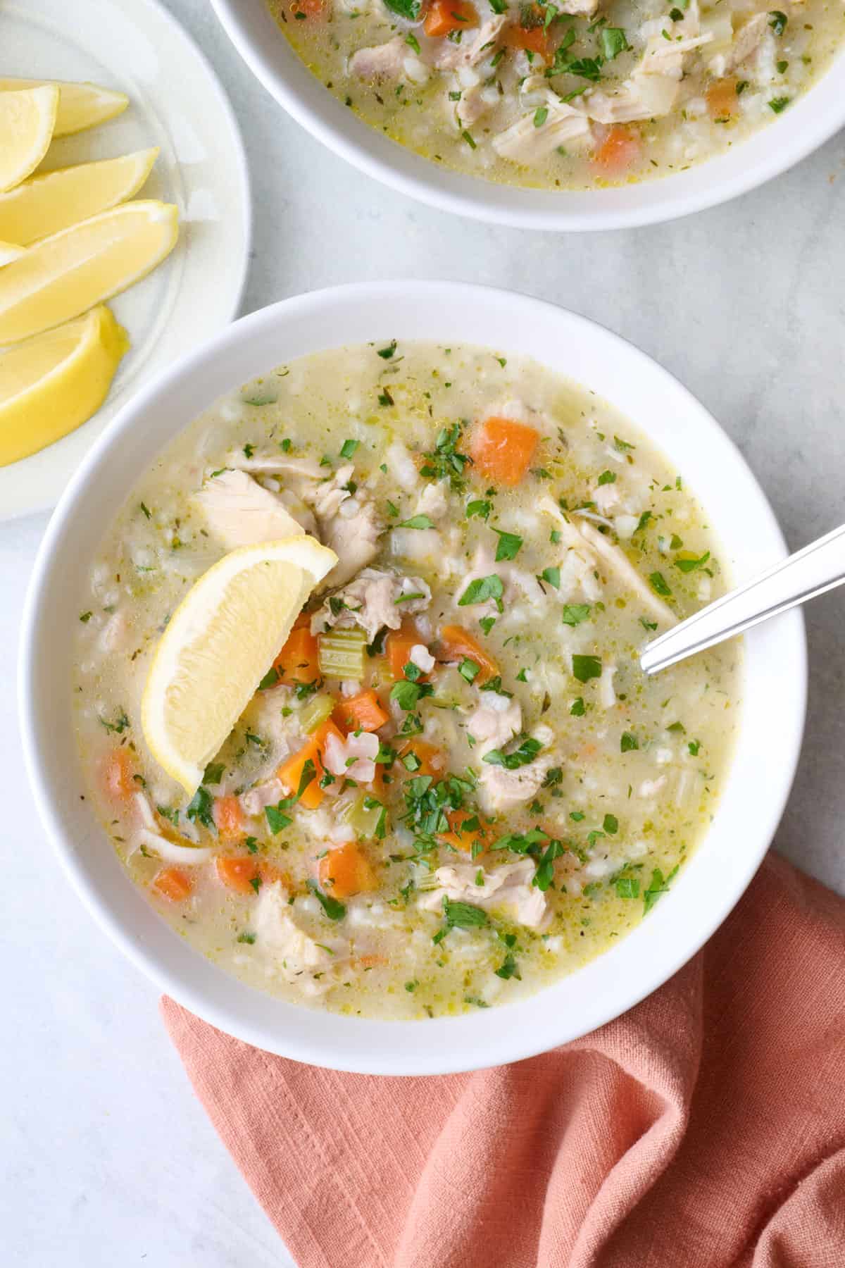 Bowl of lemon chicken rice soup.