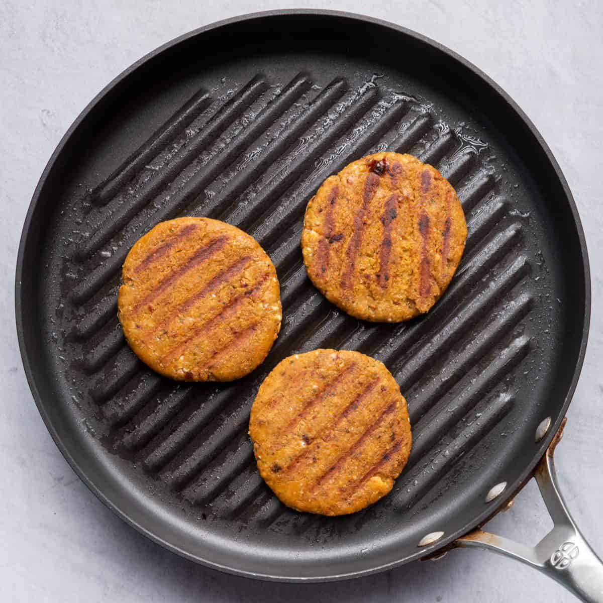 After flipping burger patties to show grill marks.