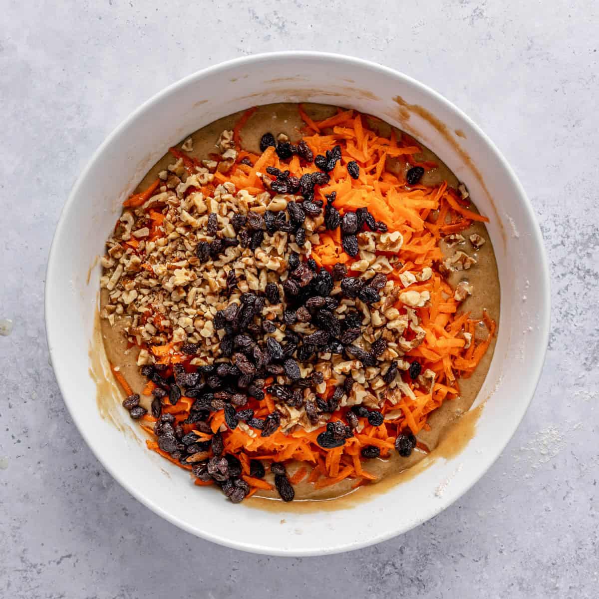 After mixing with freshly grated carrots, walnuts, and raisins added.