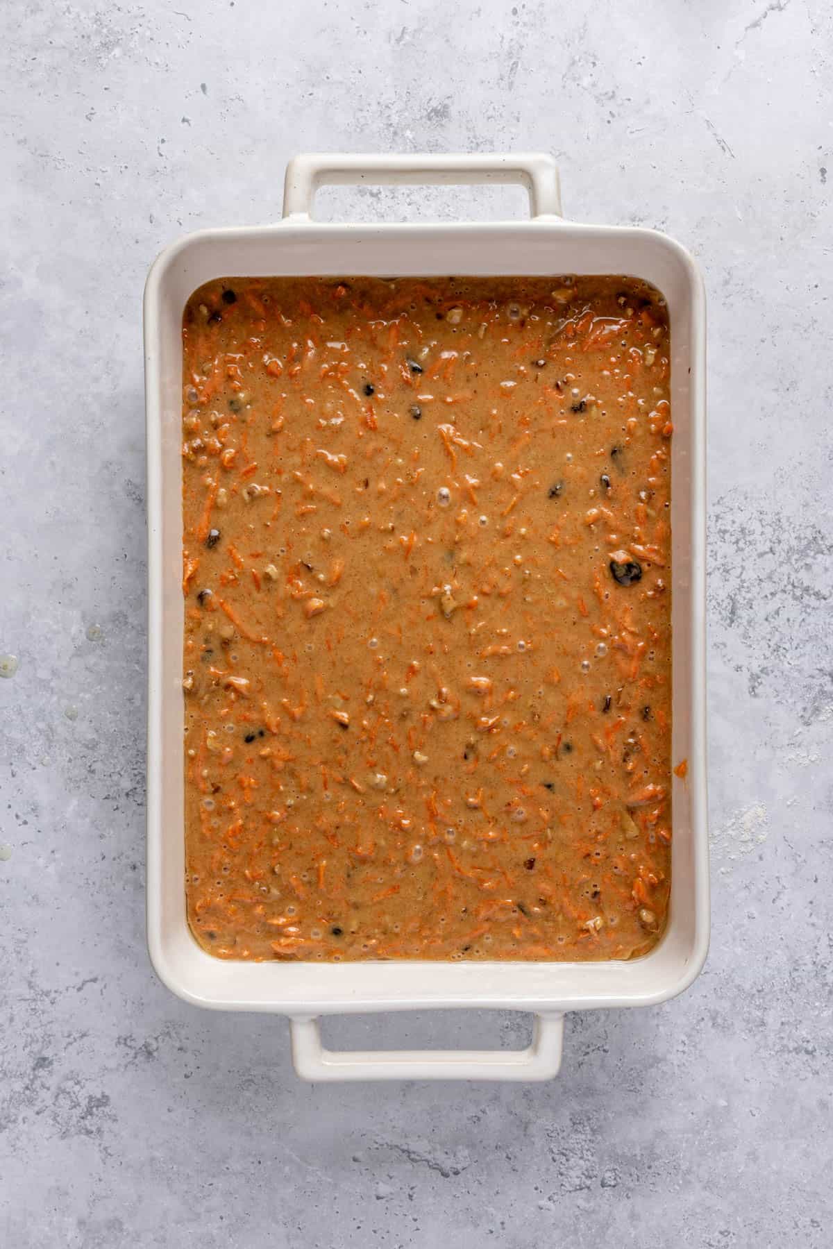 Batter in a prepared baking dish before baking.