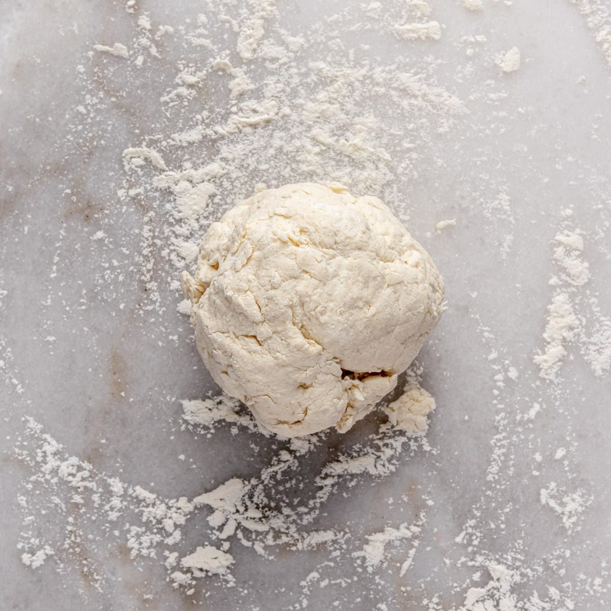 Dough on a lightly floured surface before kneading.