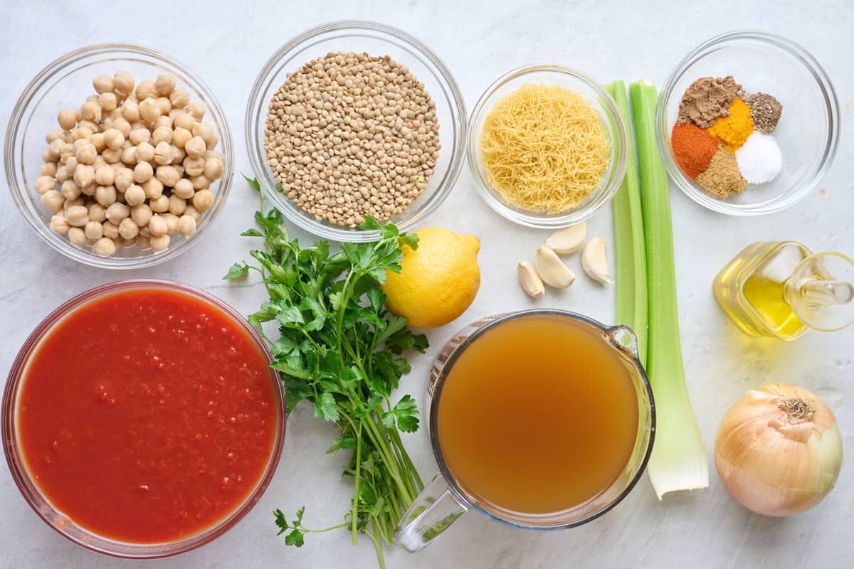 Ingredients for recipe: chickpeas, crushed tomatoes, lentils, parsley, lemon, garlic, vermicelli, garlic, broth, celery, oil, onion, and spices.