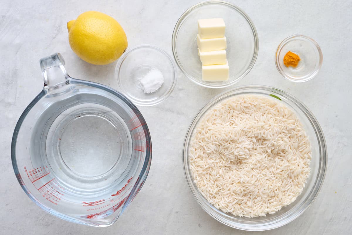 Ingredients for recipe: water, lemon, salt, butter, turmeric, and rice.