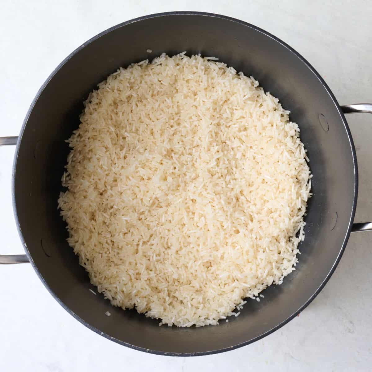 Rice and butter after tossing together in pot.