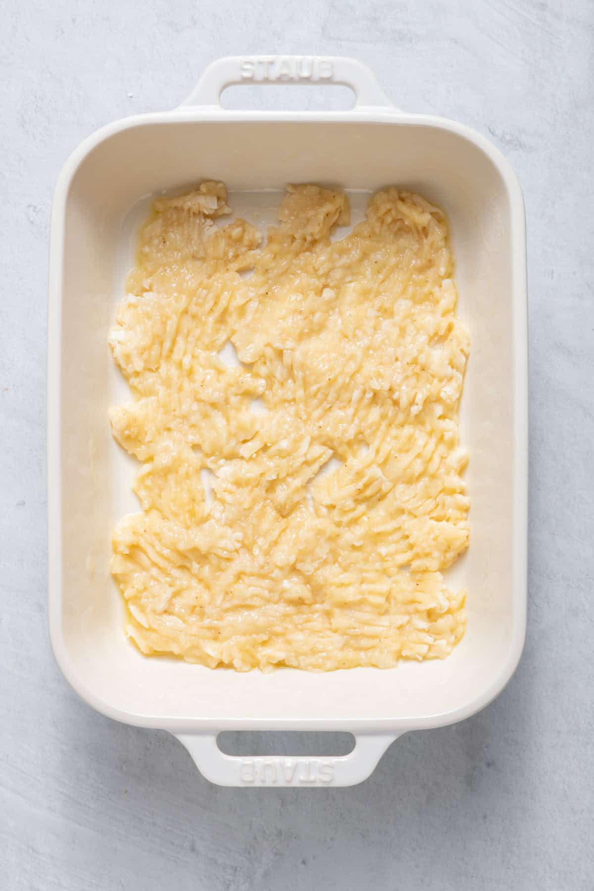 Mashed bananas in a baking dish.