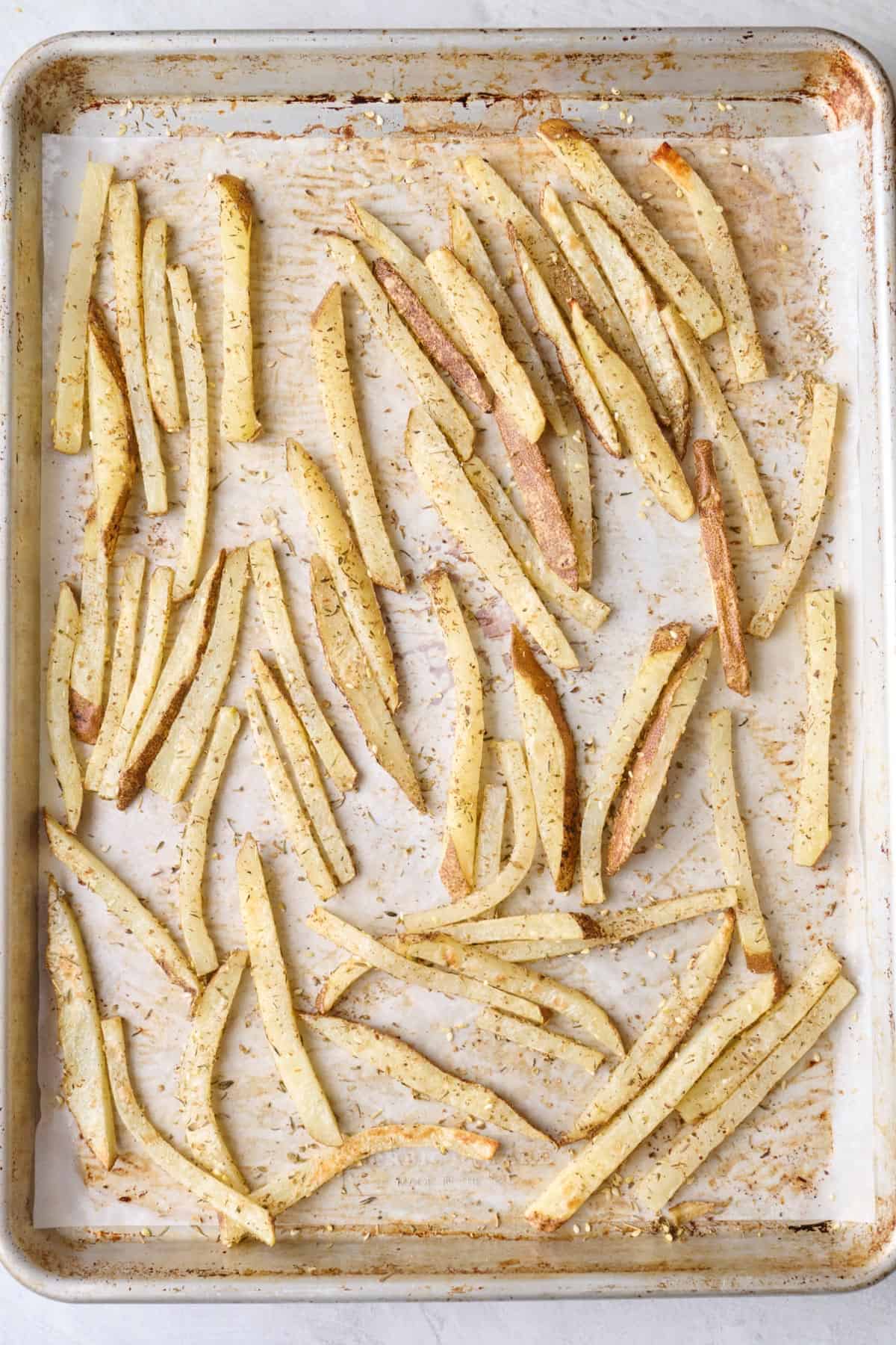 Seasoned fries arranged in a single layer.