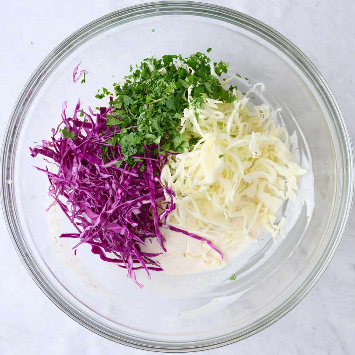 Shredded cabbage and cilantro added to dressing.