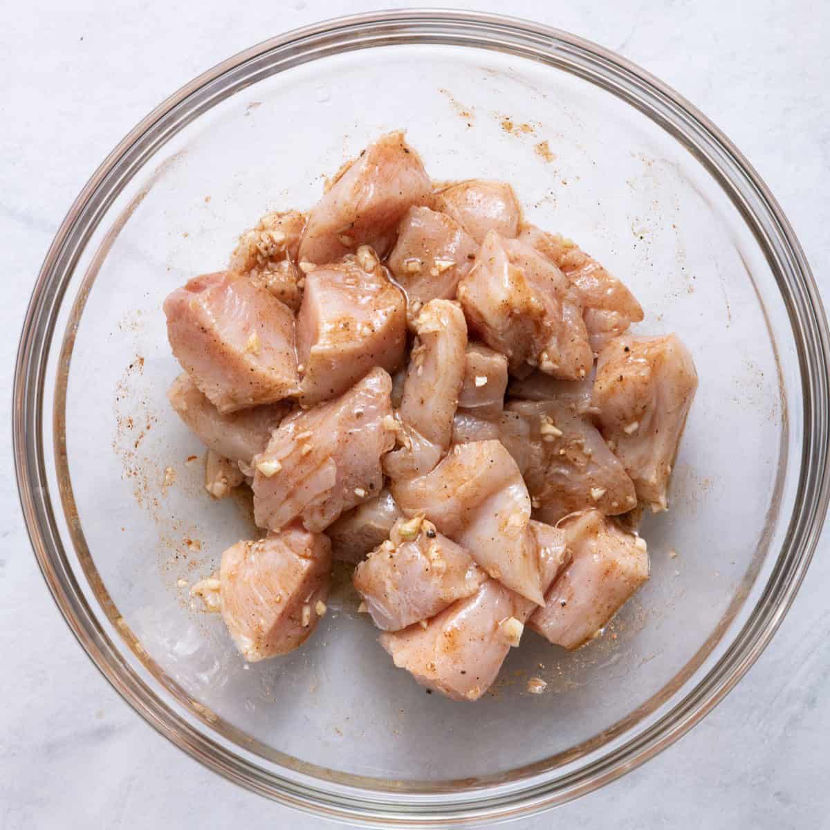 Chicken mixed in with marinade.