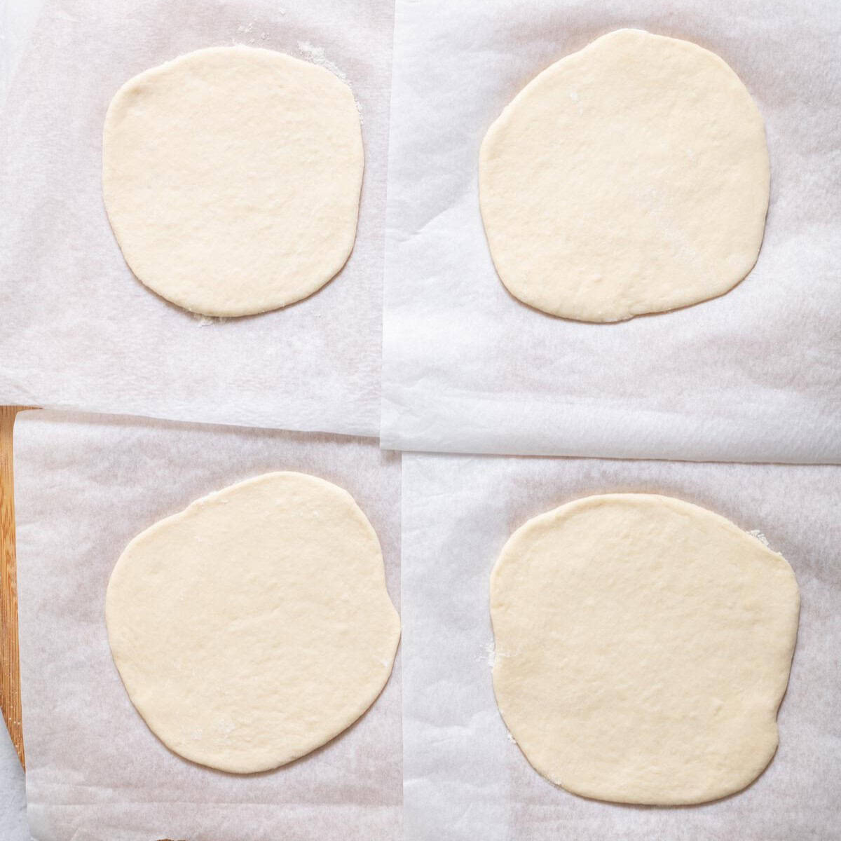 Dough rolled out and resting onto small squares of parchment paper.