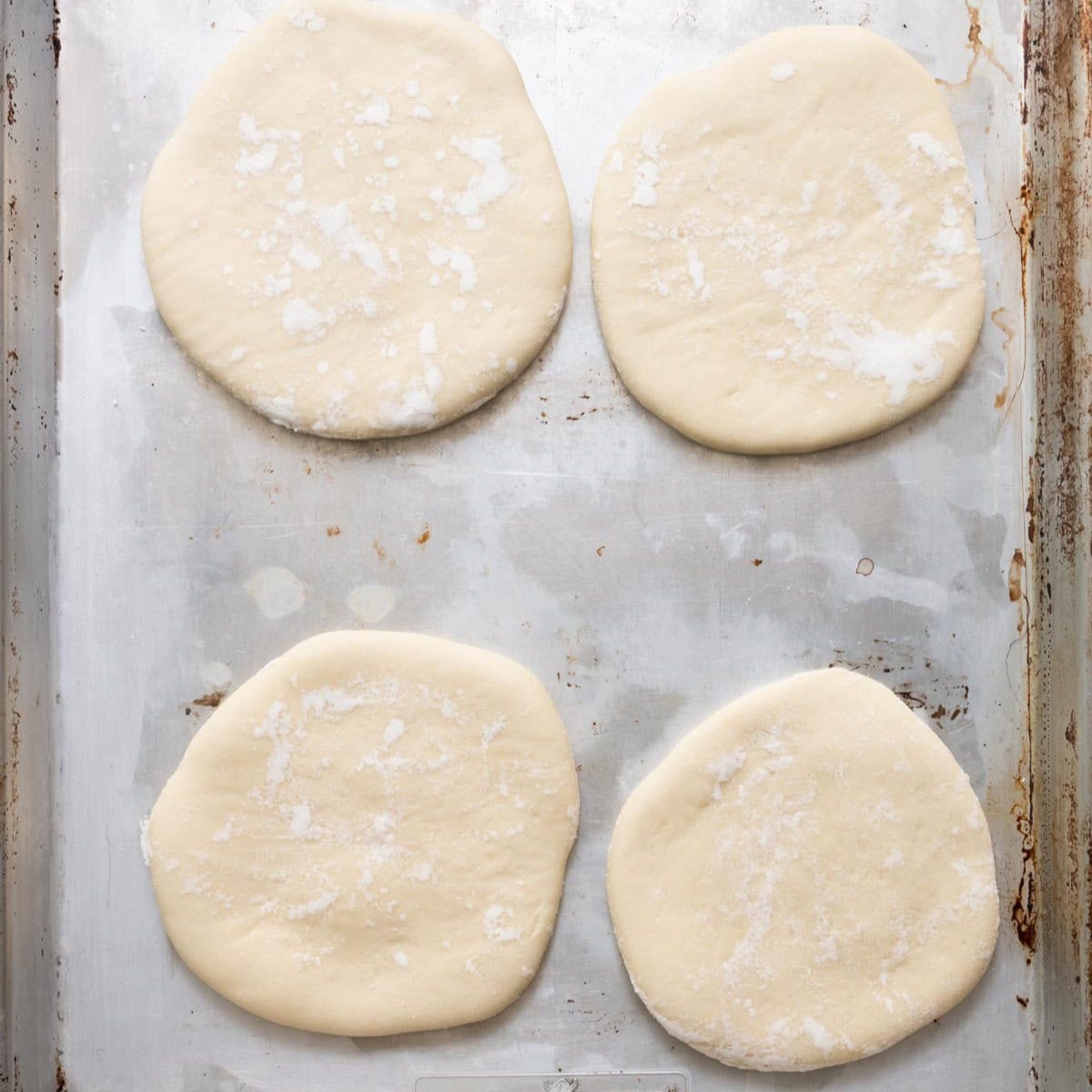 Dough transferred to large half sheet pan.