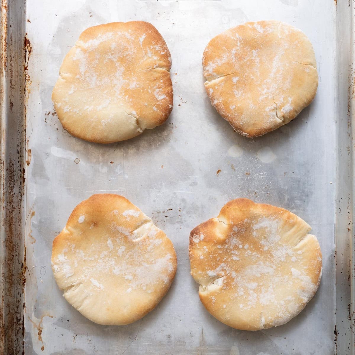 Pita out of the oven still on baking sheet.