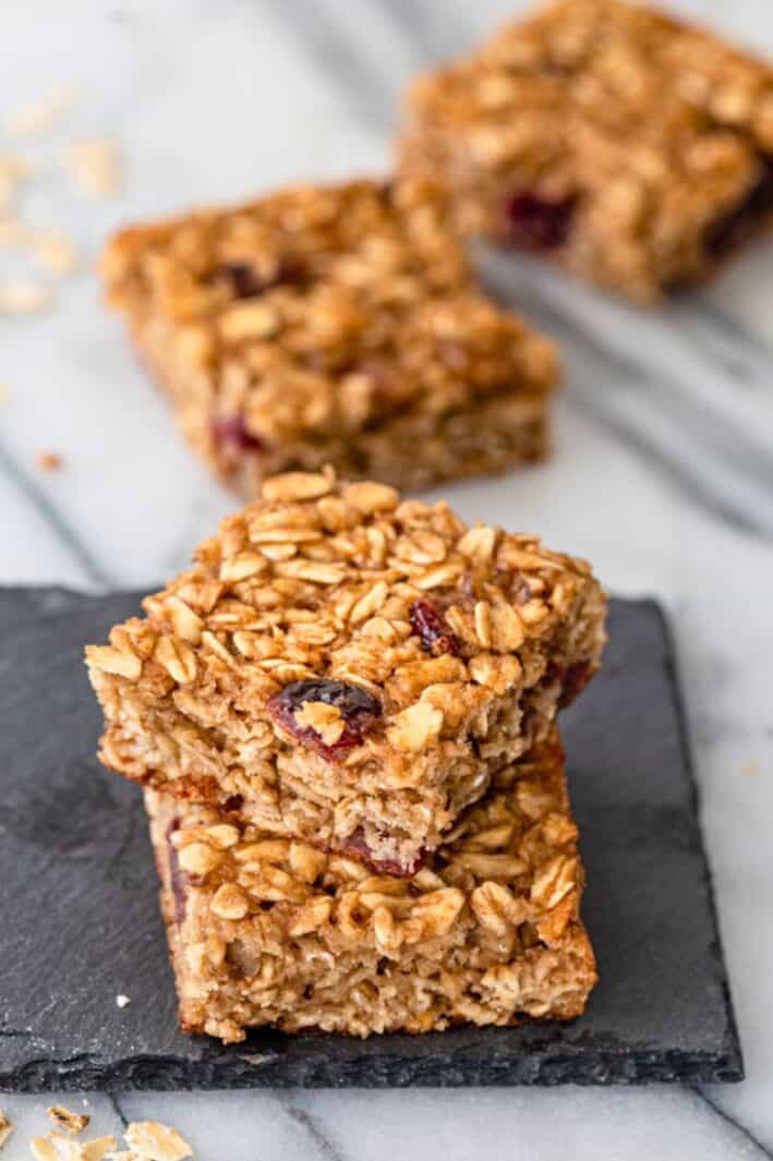 Homemade oatmeal breakfast bars with dried fruit.