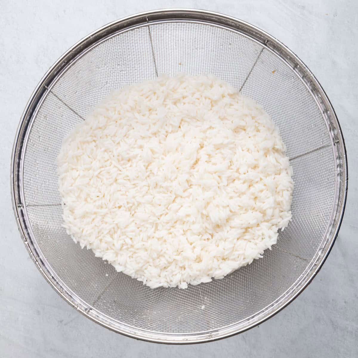Drained and rinsed al dente cooked rice.