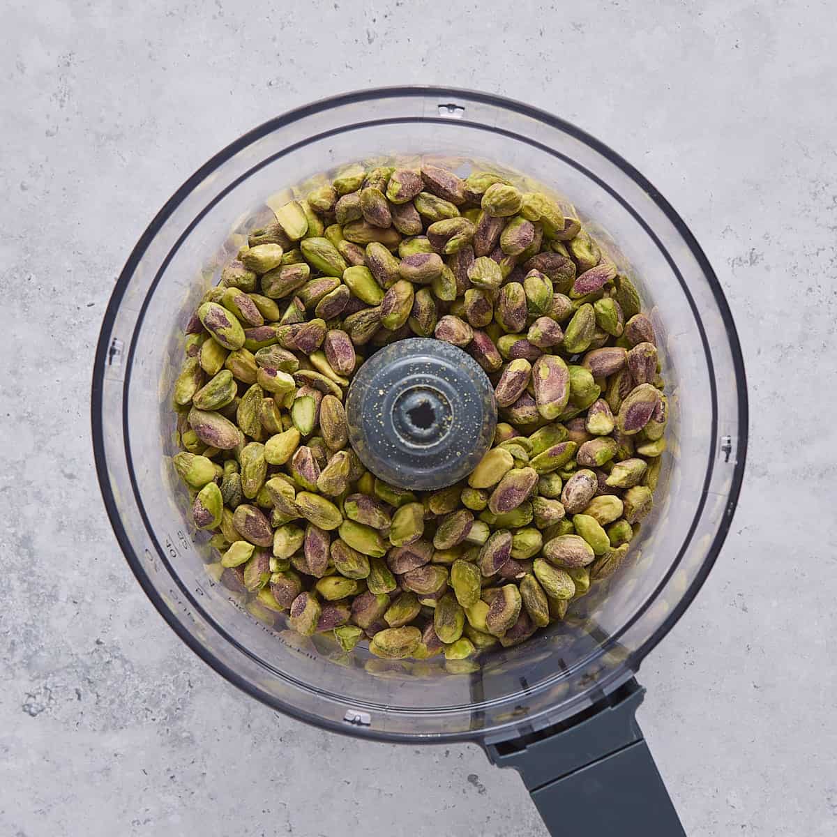 Pistachios in a food processor.