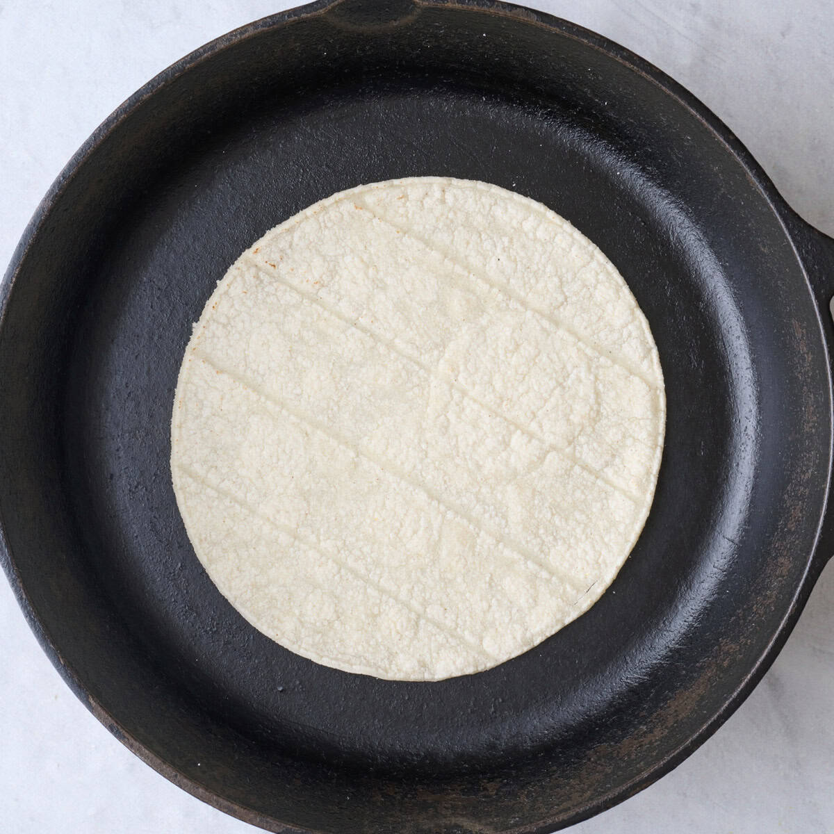 Tortillas in a dry skillet.