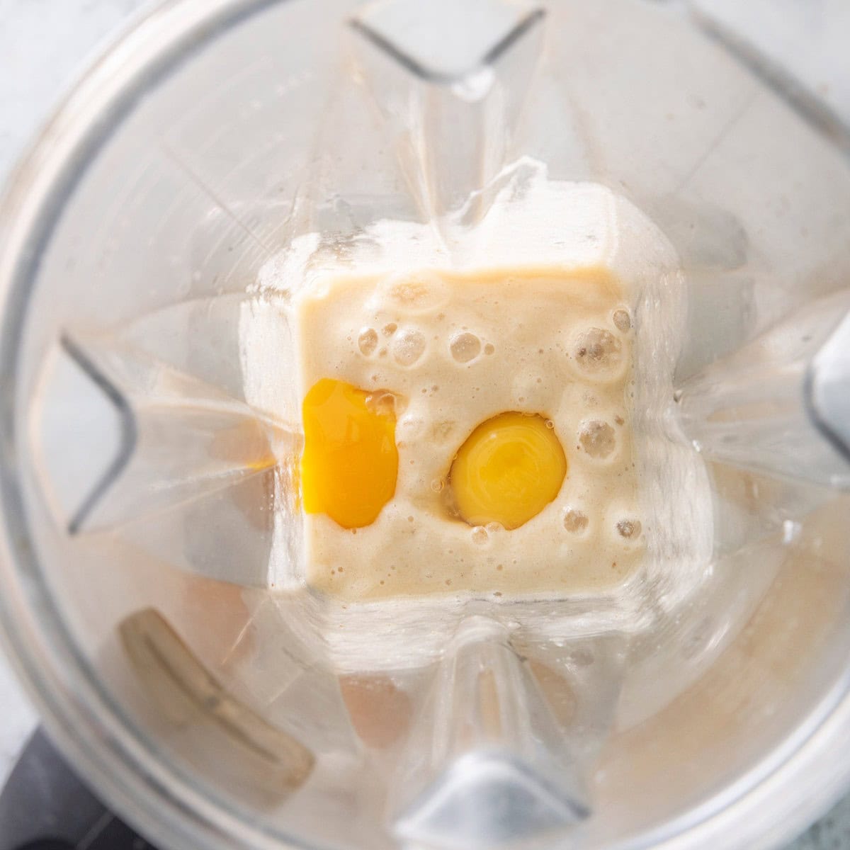 Eggs added to banana mixture in blender.