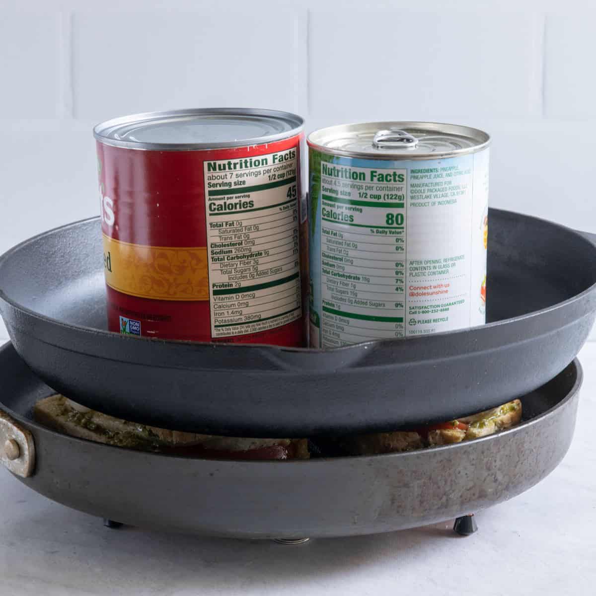 Heavy pan and 2 cans added on top of the panini.