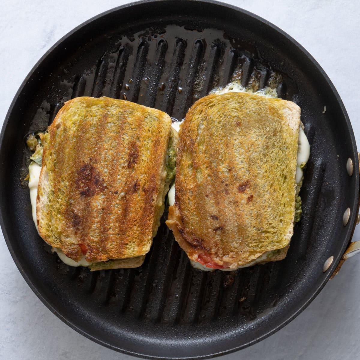 Cooked sandwiches on grill pan.