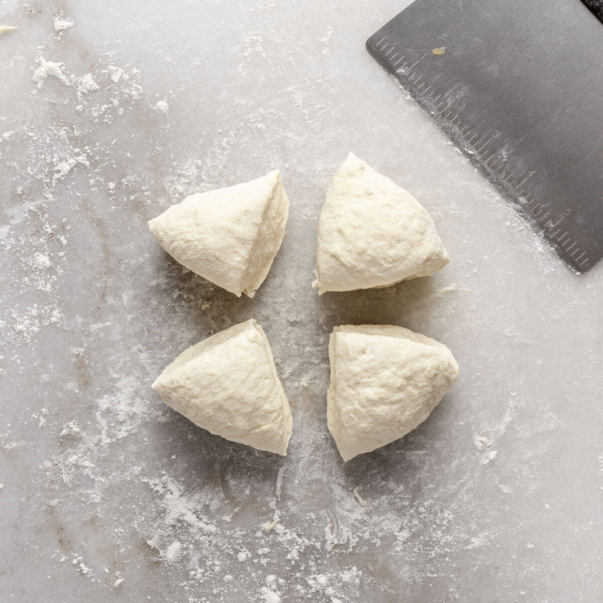 Dough divided into 4 equal pieces.