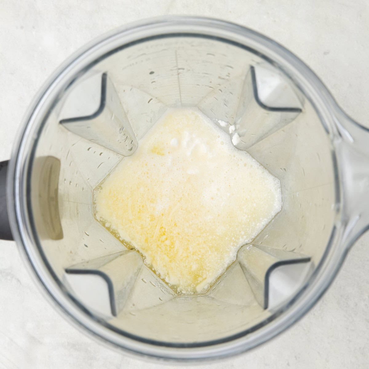 Egg whites, mozzarella cheese, cottage cheese and feta cheese in a blender before blending.