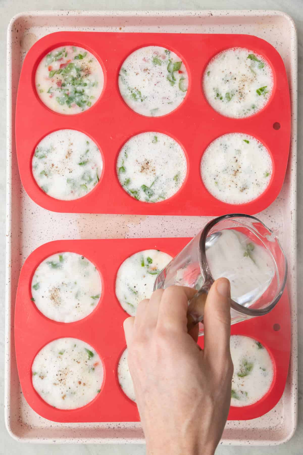 After seasoned with salt and pepper pouring water into the baking dish, about ½ way up the liners, before baking.
