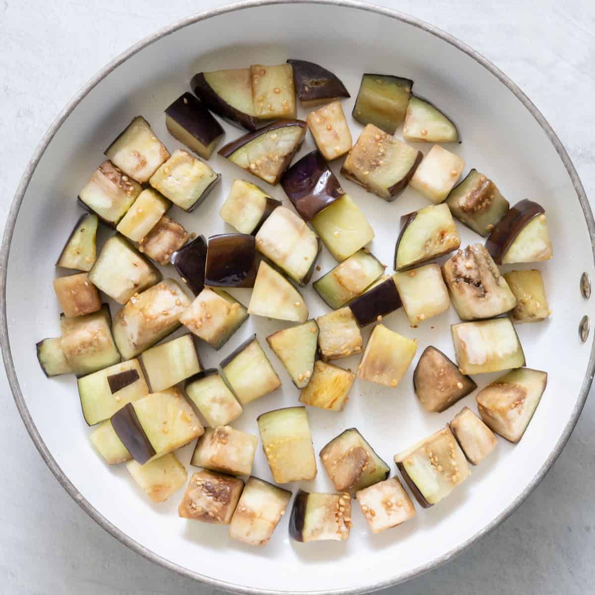 Cooked eggplant in pot.