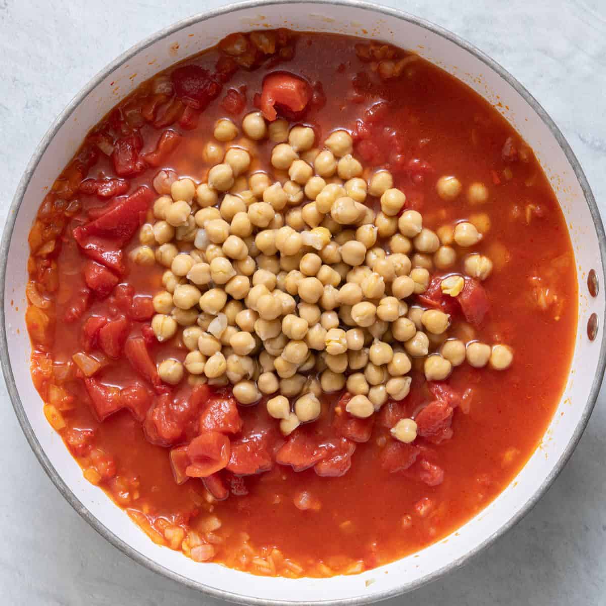 Diced tomatoes, chickpeas and water added.