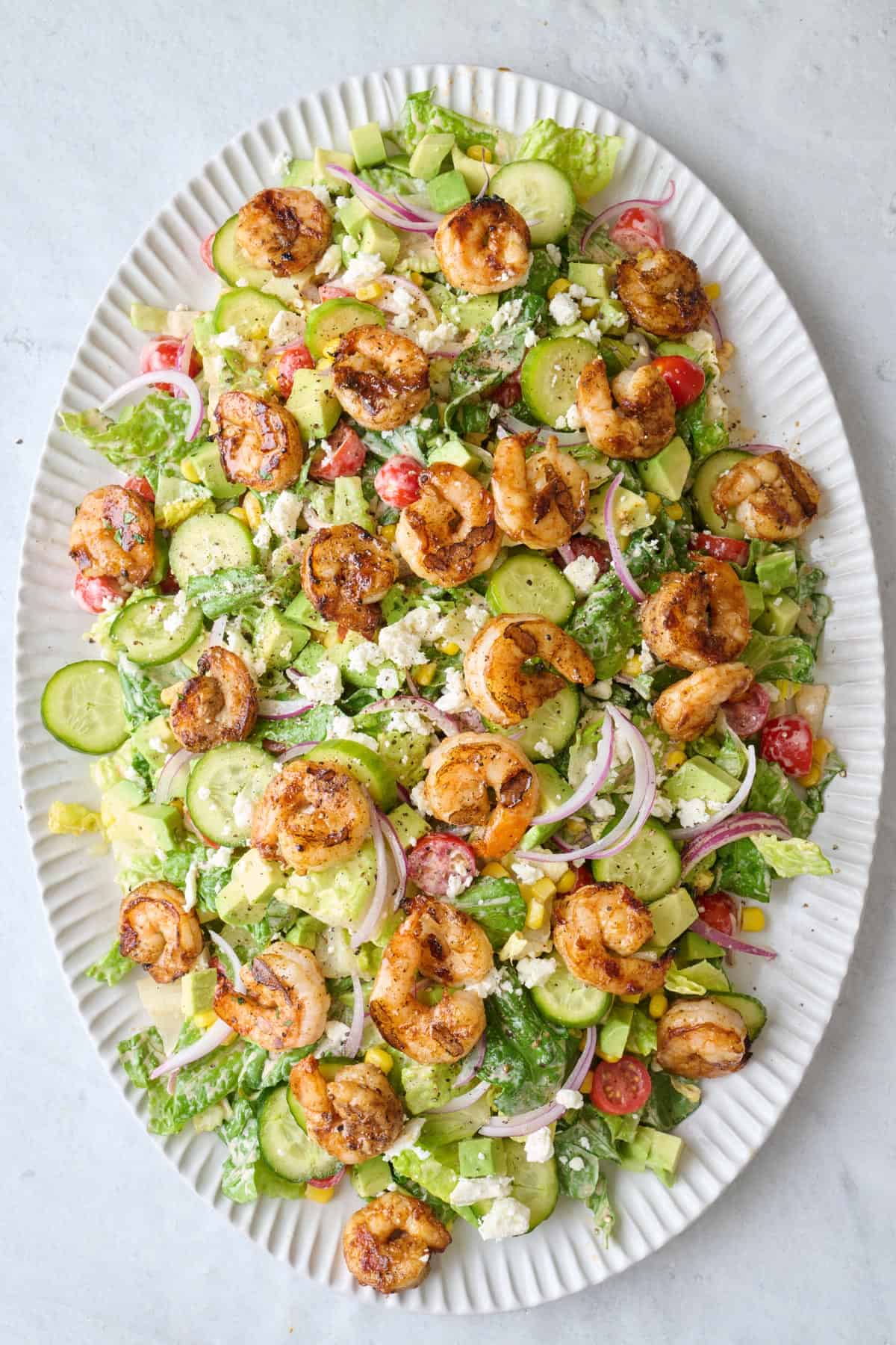 Grilled shrimp, avocado, cucumber and feta added on top.