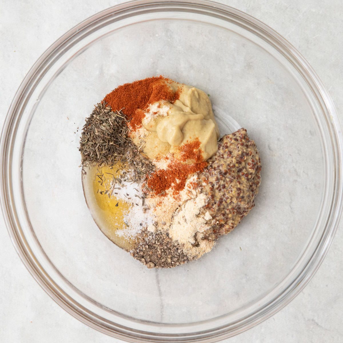 Honey mustard sauce ingredients in a bowl before combining.