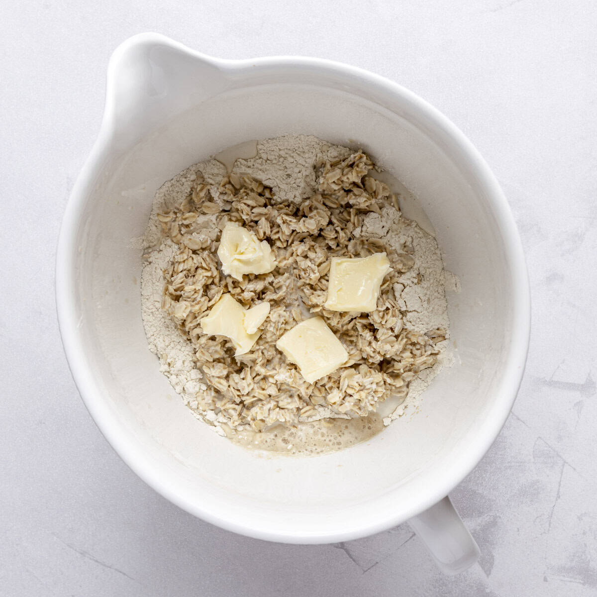 After foamy with oat mixture, flour and butter added.