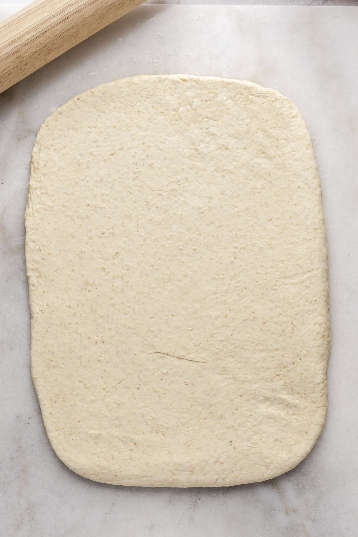 Dough flattened into a 14x10 rectangle.