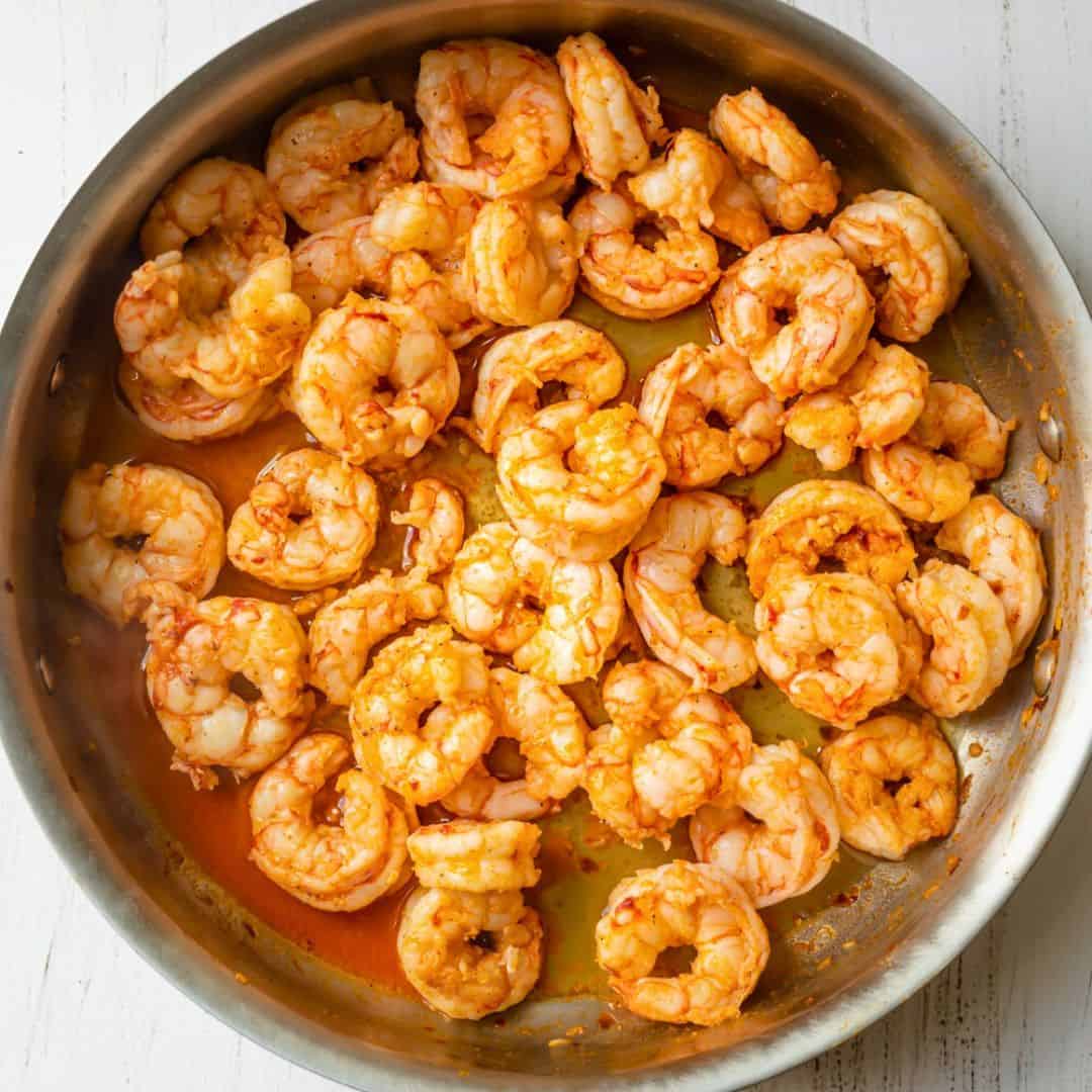 After cooking shrimp in pan with butter sauce.