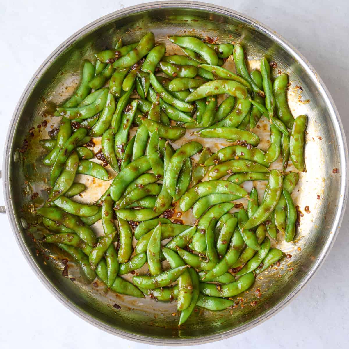 After tossing edamame in sauce.