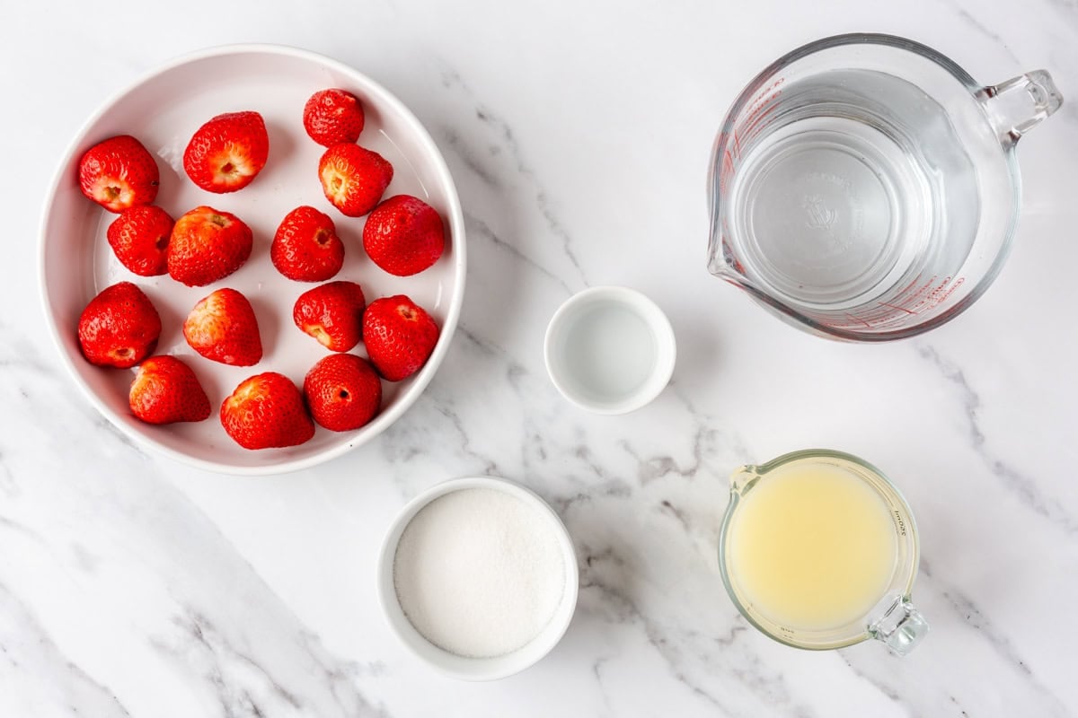 Ingredients for recipe: fresh strawberries, sugar, lemon juice, water, and rose water.