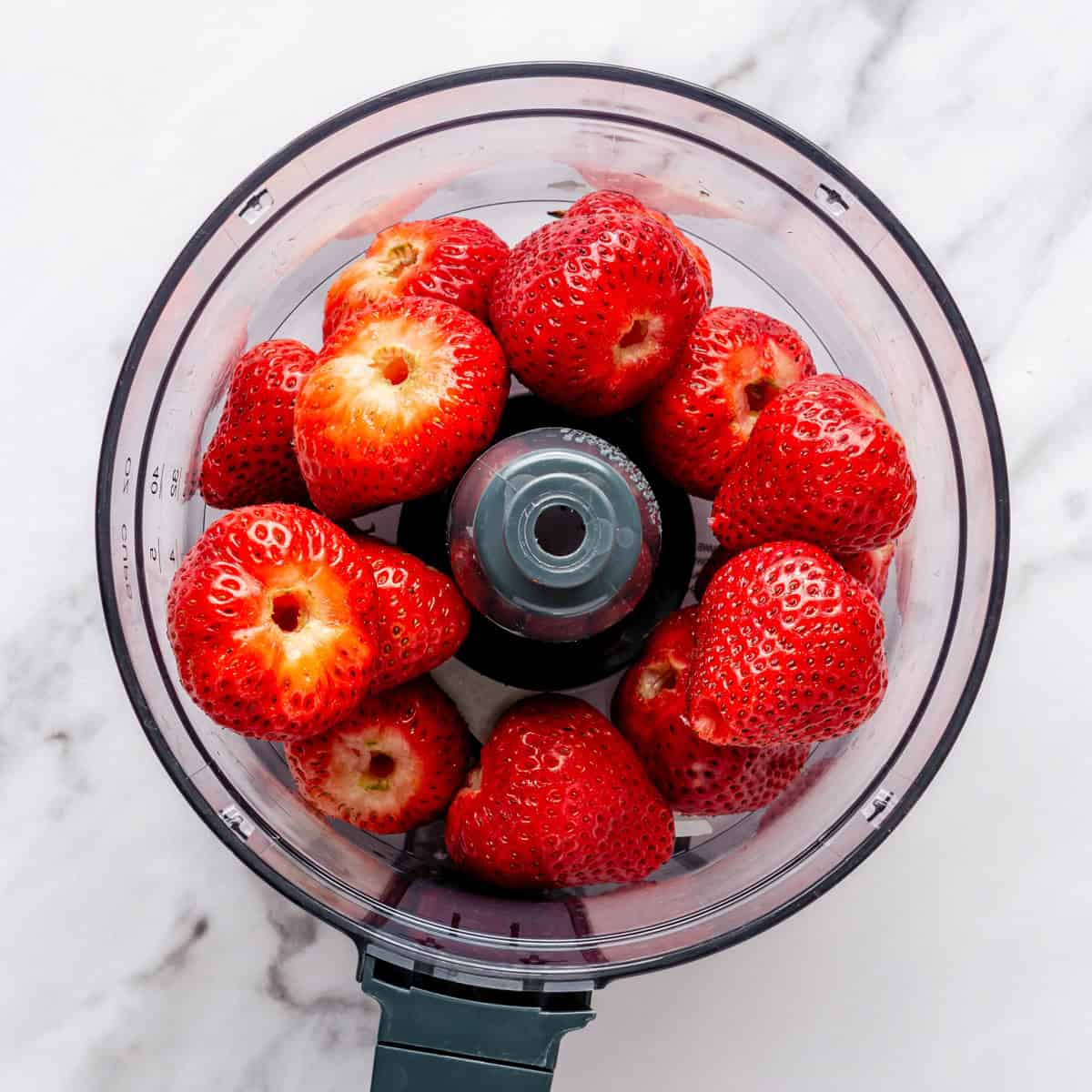 Strawberries in a food processor.