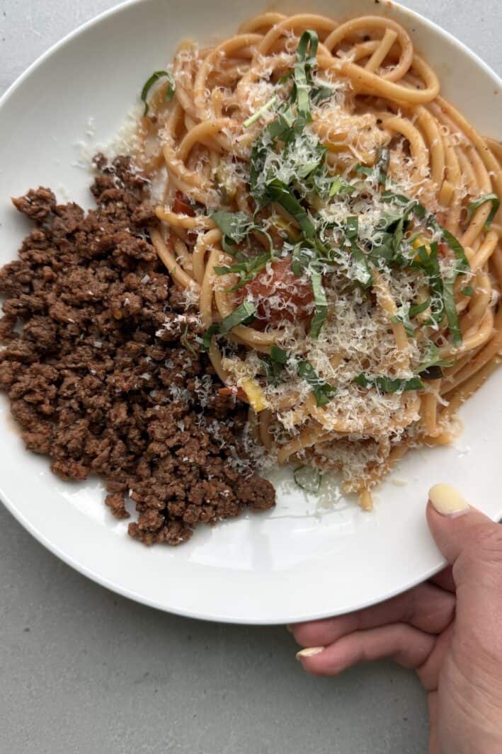 Vegetable spaghetti on a plate with cooked ground beef