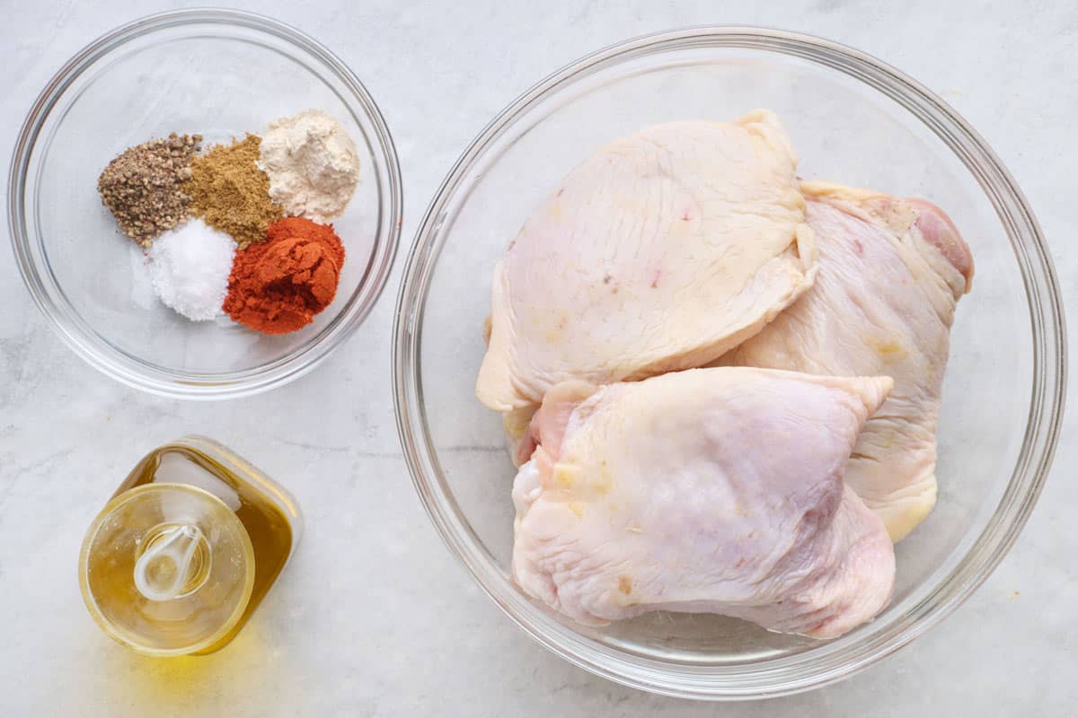 Ingredients for recipe: bone in, skin on chicken thighs, oil, and seasoning blend.