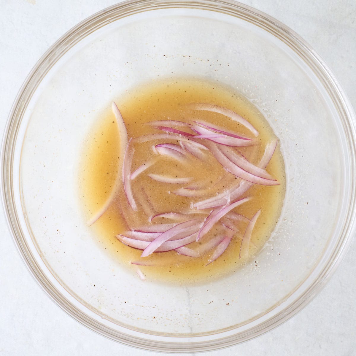 Dressing with red onions added.