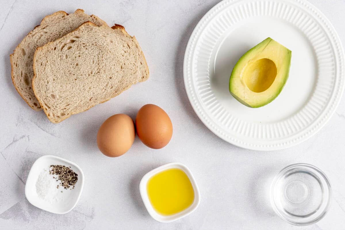 Ingredients for recipe: sliced sourdough bread, avocado, eggs, salt and pepper, butter and vinegar.