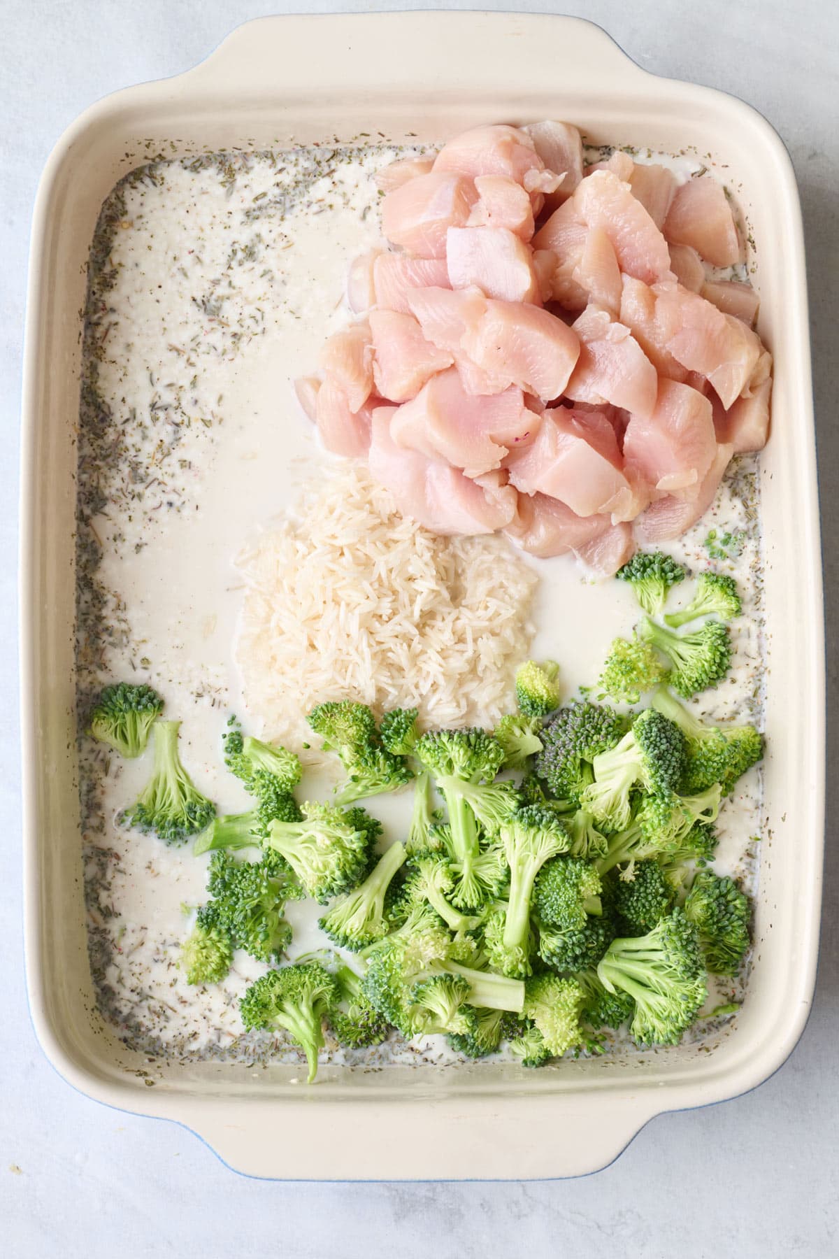 After whisked smooth with uncooked rice, cubed chicken and broccoli florets added.