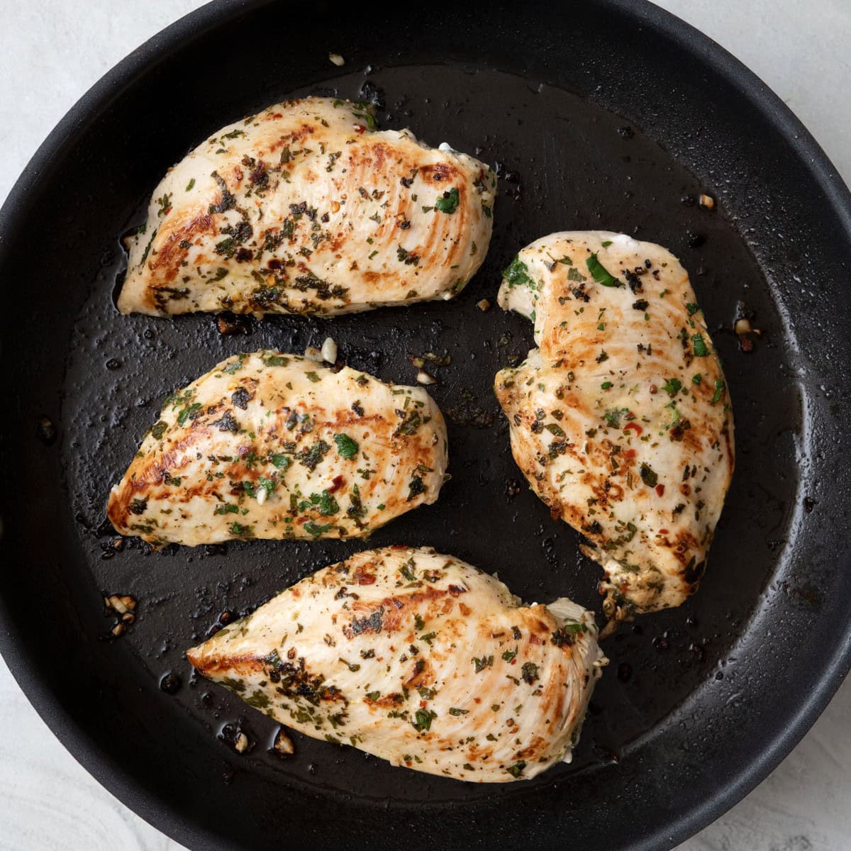 Cilantro chicken after cooking in a skillet.